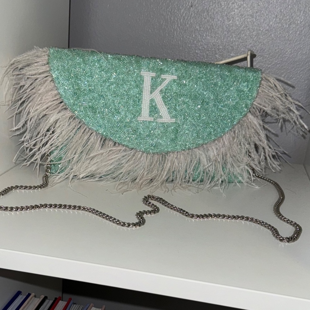 Beaded clutch/crossbody with feathers